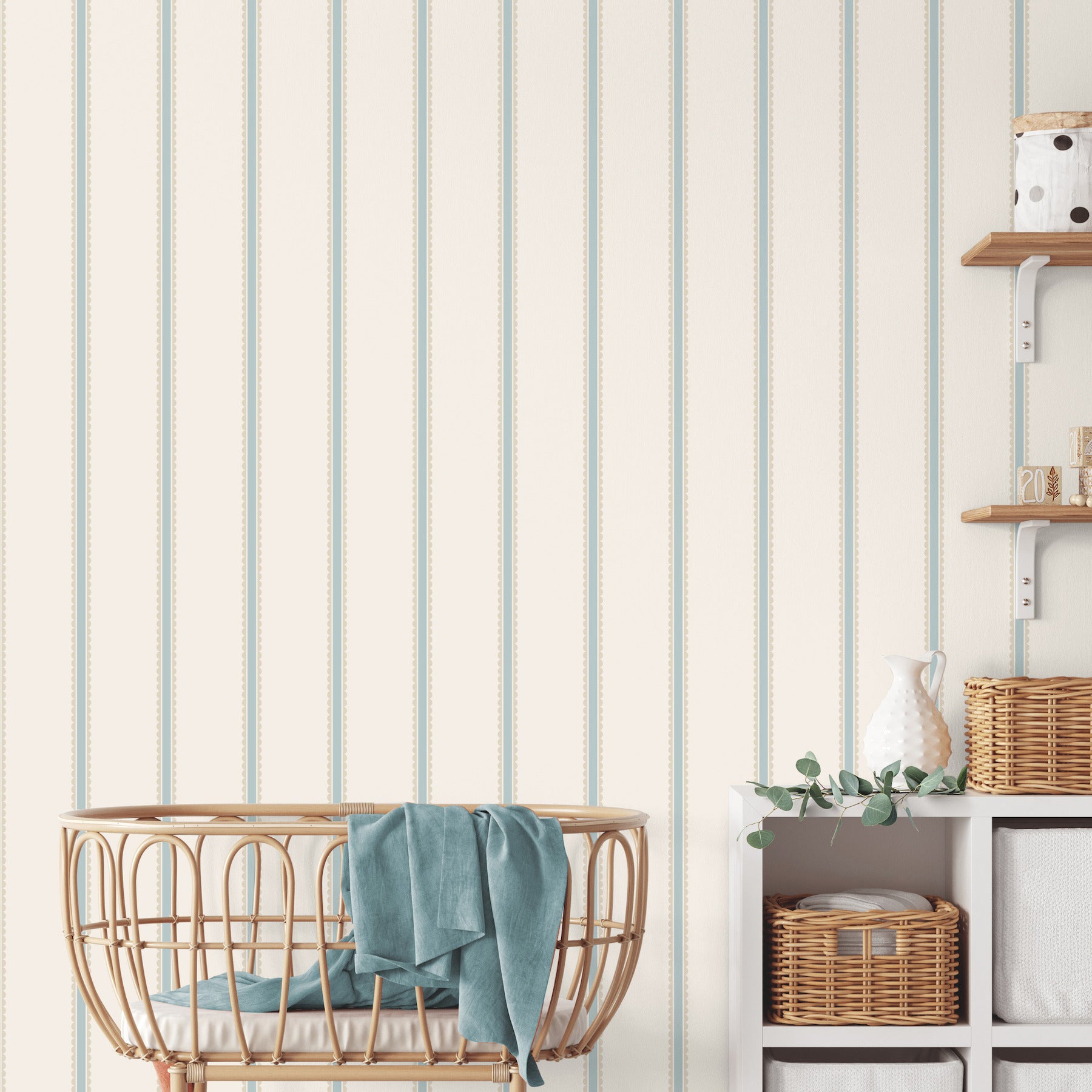 Light blue scalloped bobbin stripe wallpaper with whimsical graphics on a wall.