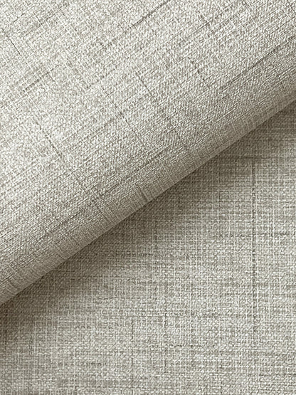 Light grey faux fabric wallpaper with a linen-like crosshatch texture.