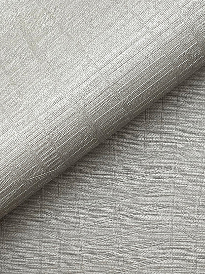 Silver-gray embossed wallpaper with metallic sheen & crosshatched lines; rolled edge.