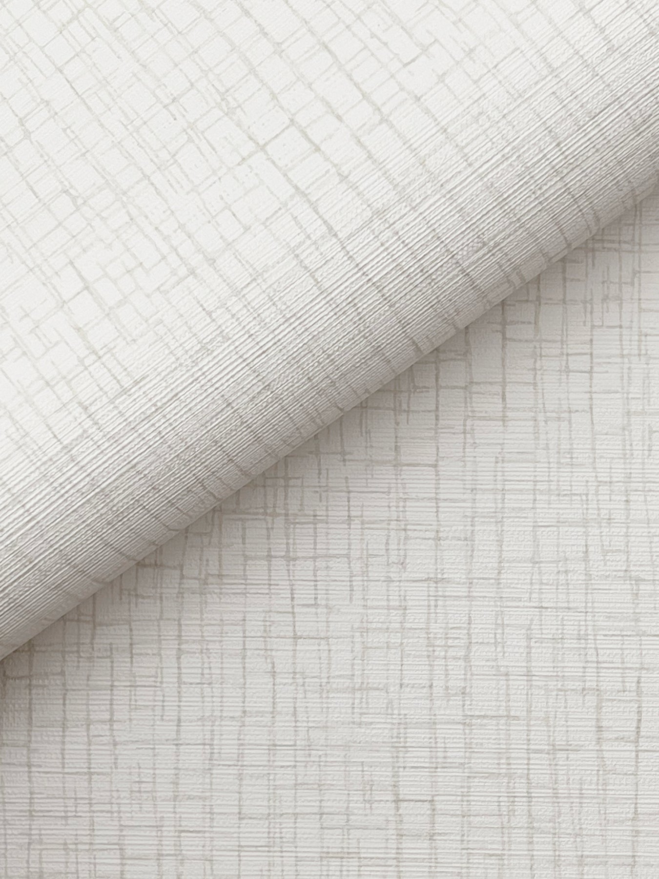 White wallpaper with a subtle linear crosshatch pattern and a rolled edge.