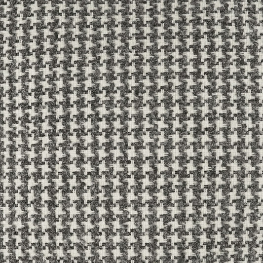 Close-up of gray and white houndstooth woven fabric texture.