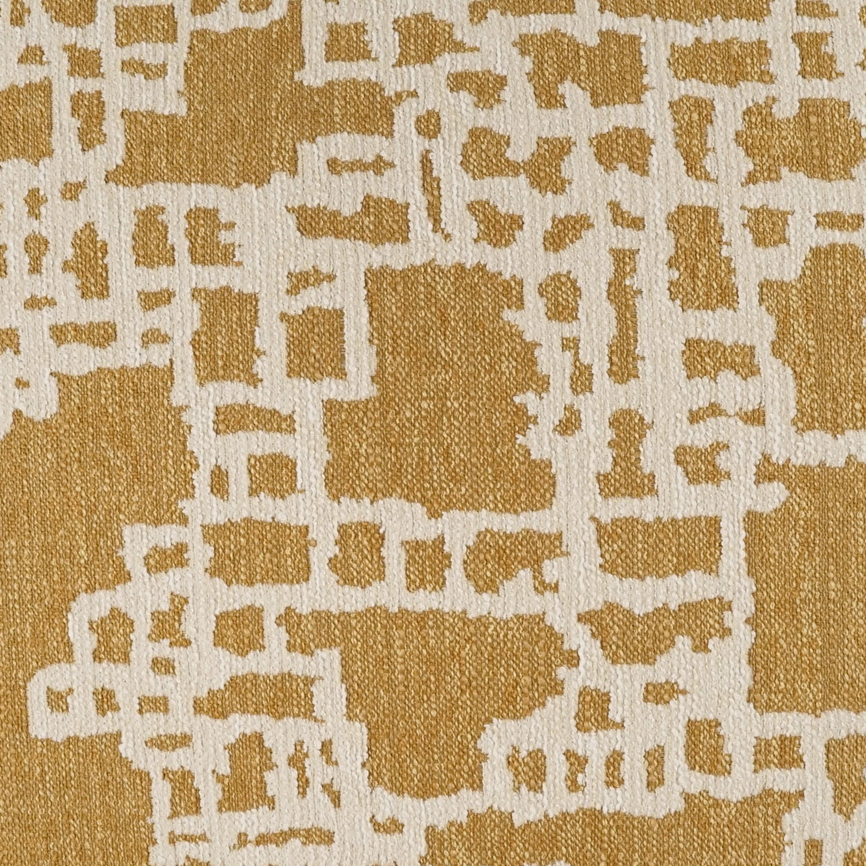 Mustard gold and cream abstract woven fabric with irregular block pattern; upholstery or drapery texture.
