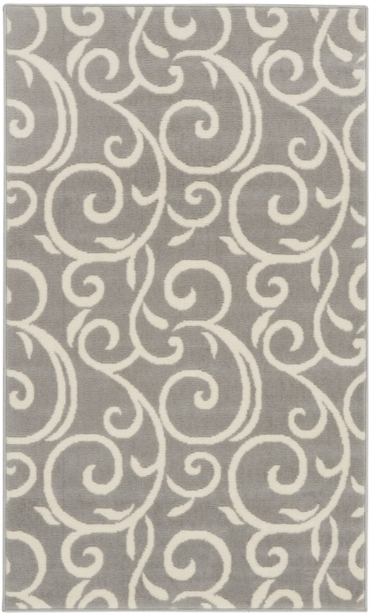 Gray rectangular rug with white scrolling motif, plush texture.