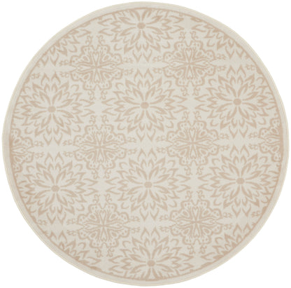 Round beige rug with cream floral medallion pattern; soft woven texture, neutral decor accent.