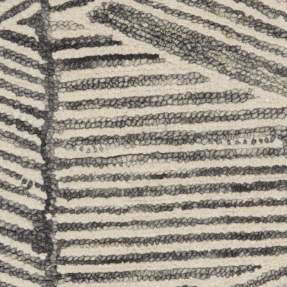 Beige zebra-striped rug with dark gray loop-pile texture for modern living spaces.