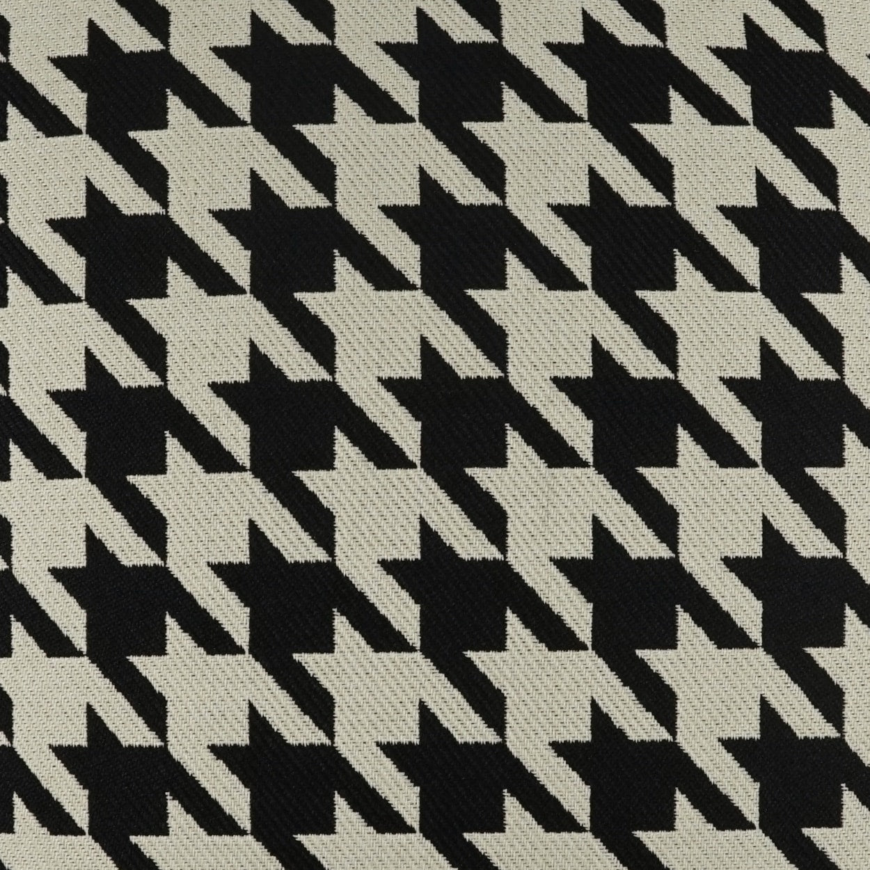Black and white houndstooth woven fabric pattern.