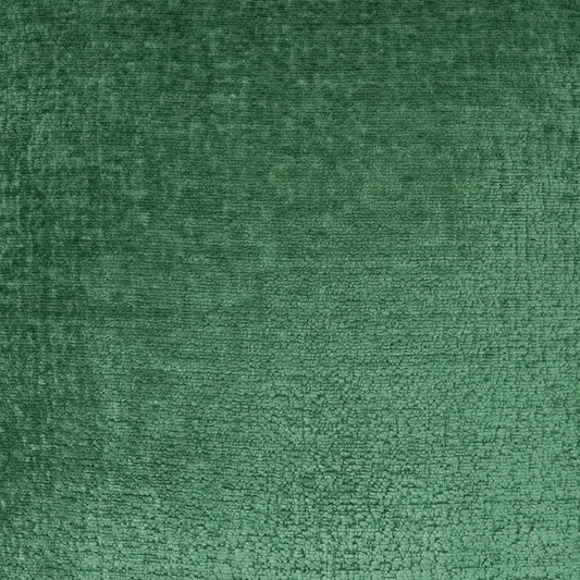 Emerald green velvet fabric close-up with soft pile and subtle sheen