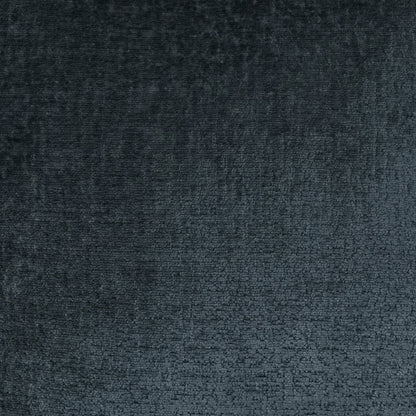 Navy solid textured fabric close-up with soft sheen and plush nap, on a pillow.