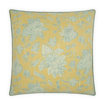 Square decorative pillow with pale blue floral damask on warm yellow fabric and teal edge piping.