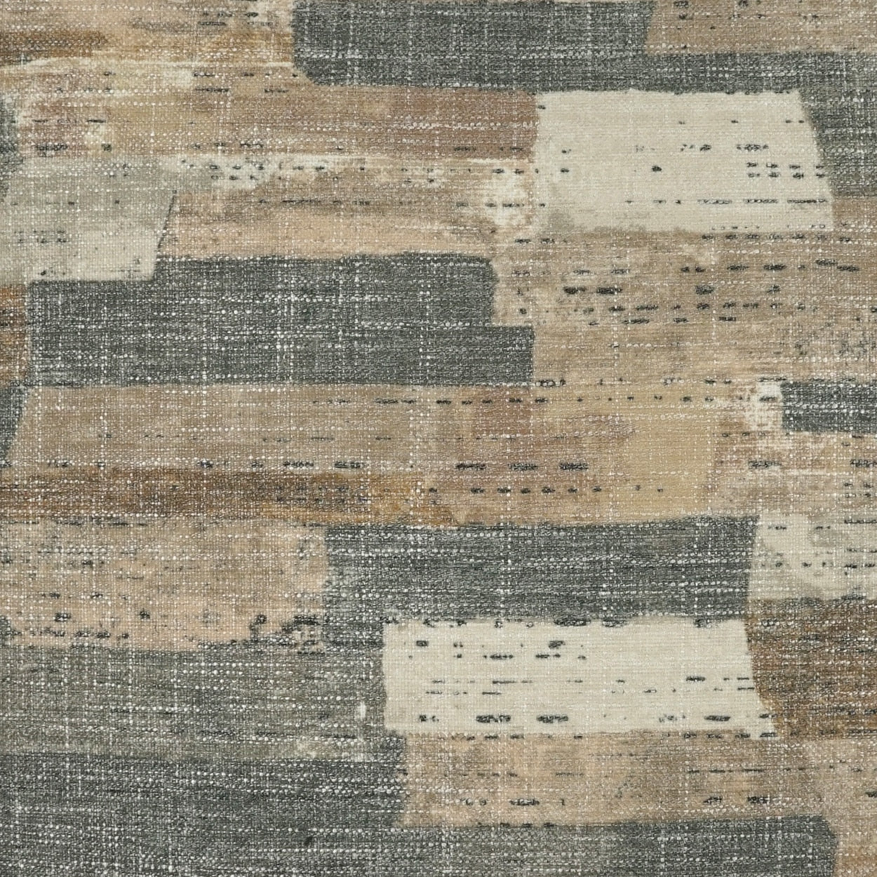 Abstract patchwork area rug in beige, taupe, cream & gray tones with distressed texture.