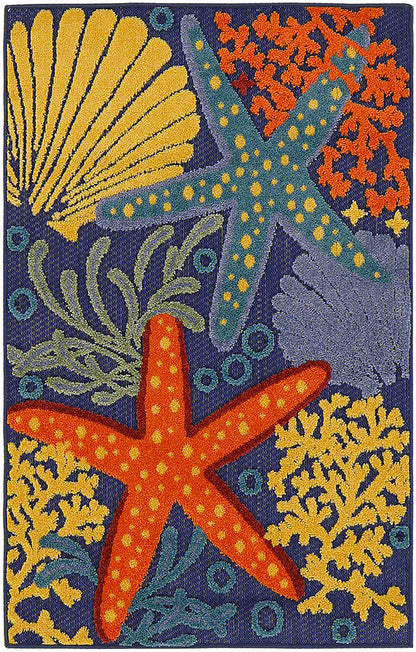 Colorful coastal tufted outdoor rug with orange starfish, blue starfish, yellow coral and shell on navy background.