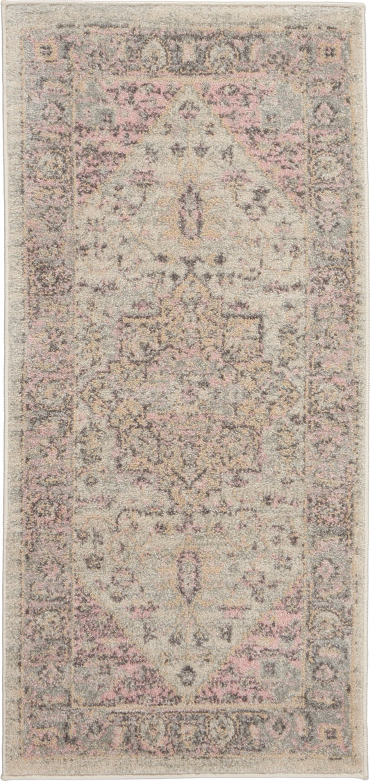 Rectangular distressed rug with pale pink, cream and gray tones; vintage-inspired oriental medallion border and motif.