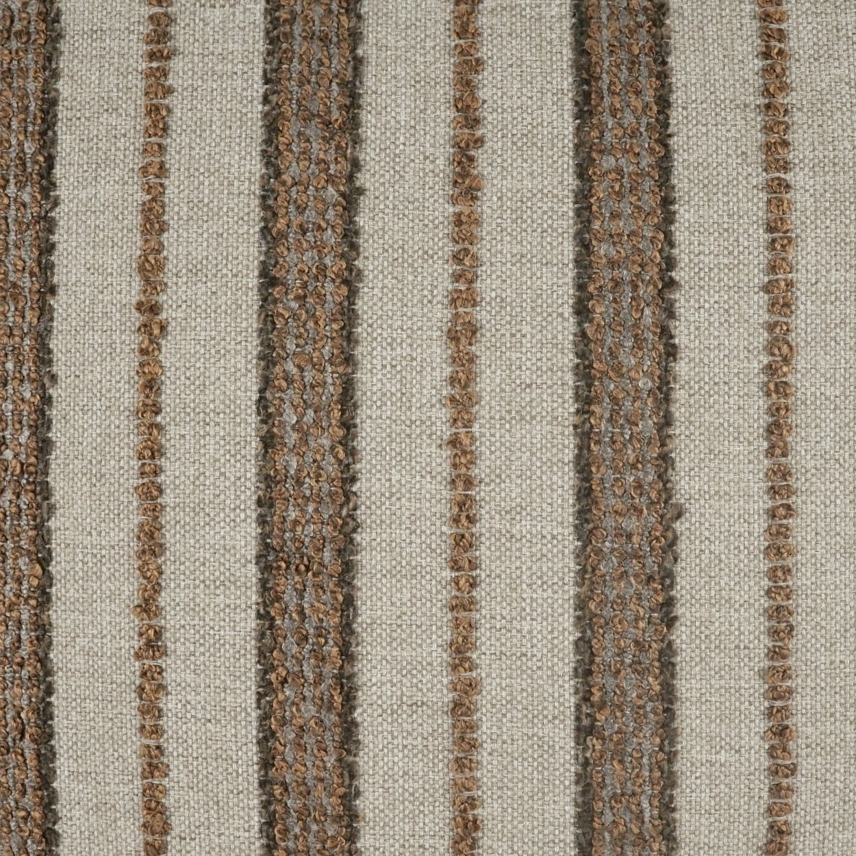 Beige woven fabric with textured brown vertical stripes; rustic upholstery or rug material.