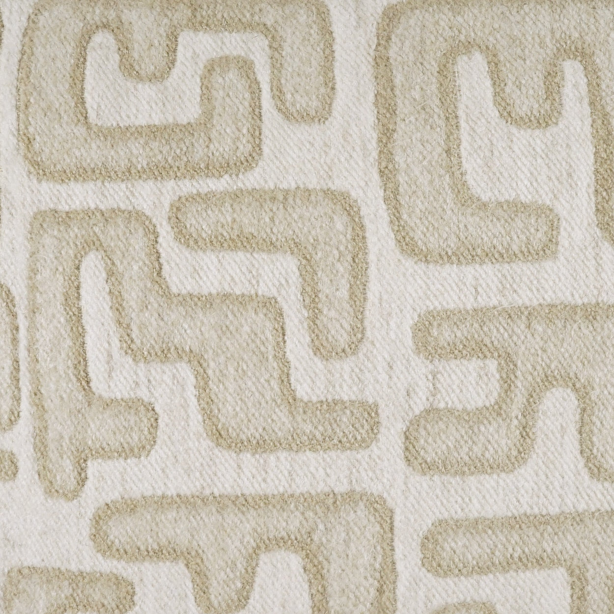 Beige geometric fabric with interlocking rounded-L shapes on cream background.