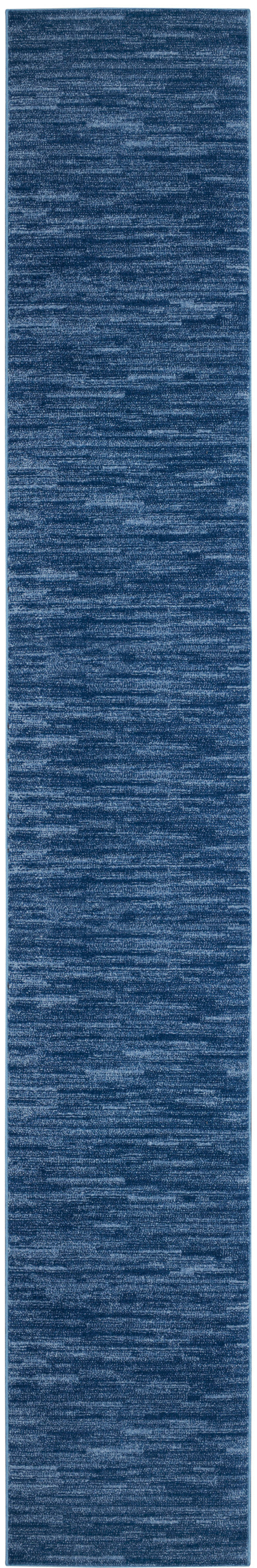 Blue heathered woven outdoor rug runner, long rectangular, textured fabric.