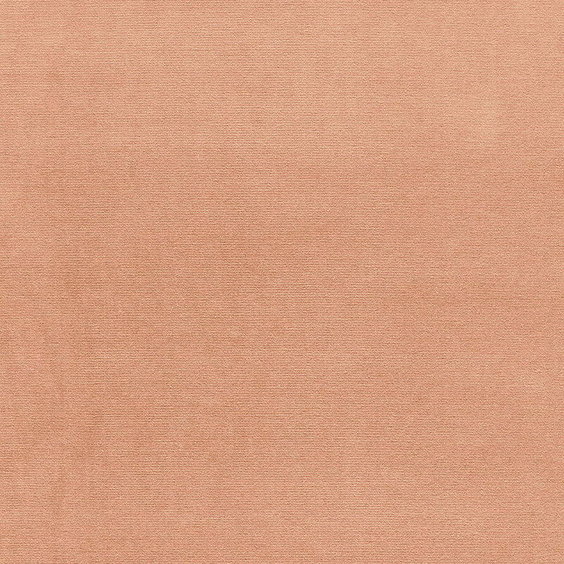 Peach fabric with fine weave texture; soft, versatile textile for clothing or home decor.