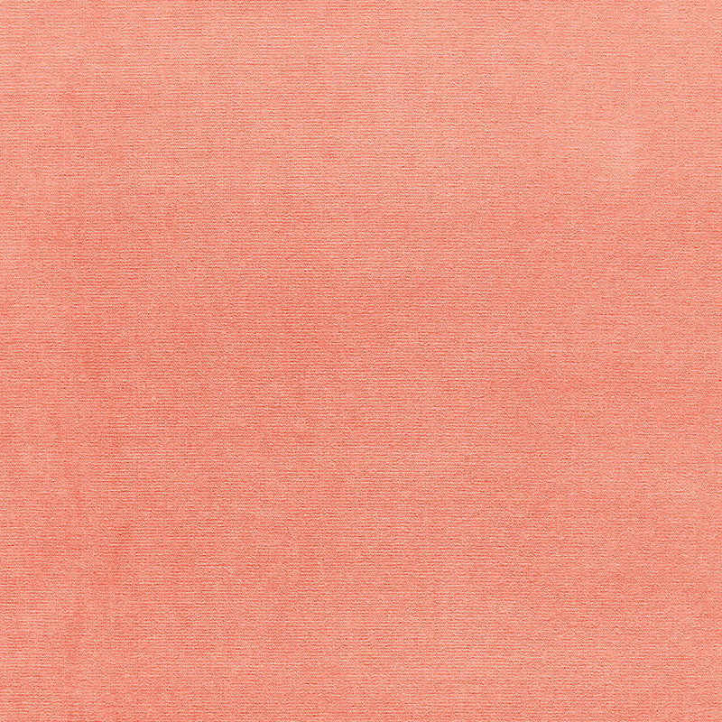 Peach knit fabric texture with subtle weave, soft casual textile.