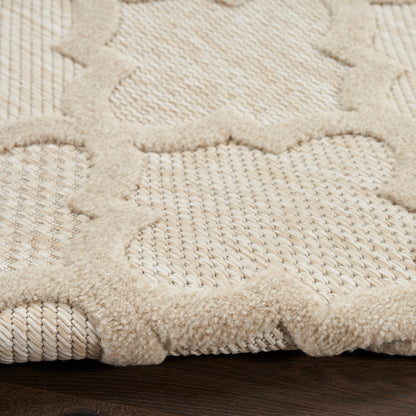 Cream textured area rug with plush, raised border and geometric lattice motif on a woven base; soft wool/cotton blend.