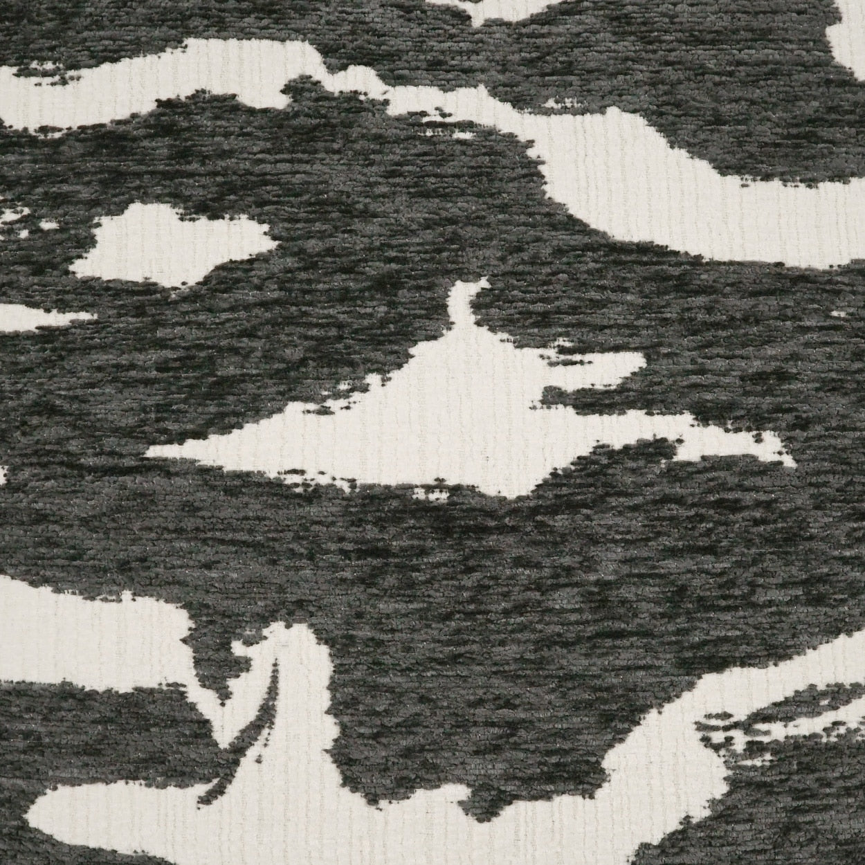 Charcoal gray and ivory camouflage fabric with a textured knit surface.