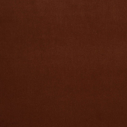 Dark brown velvet fabric texture close-up with a smooth nap.