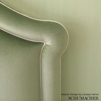 Light sage green velvet fabric swatch showing soft nap.