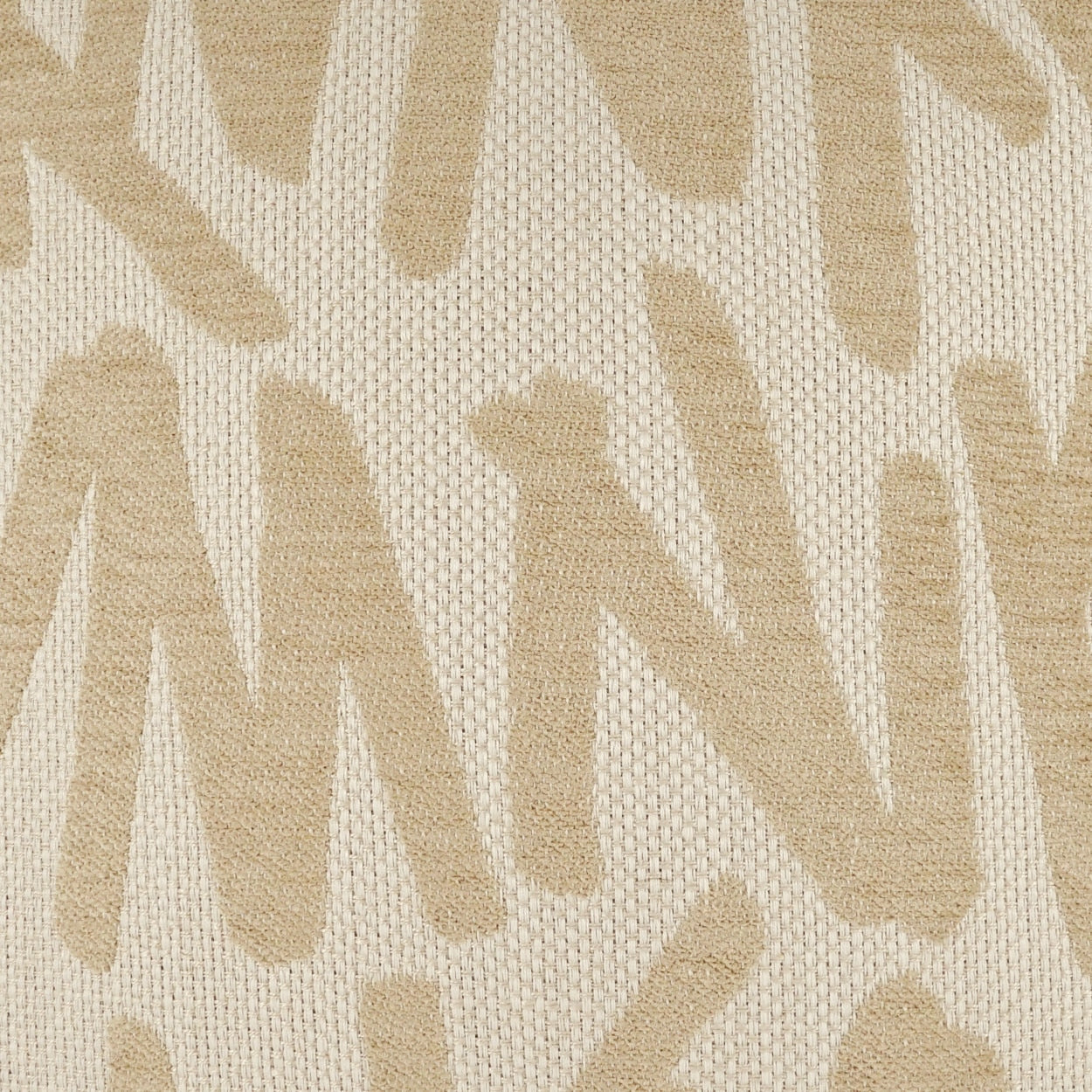 Beige woven fabric with tan abstract letter-motif pattern; soft upholstery textile for cushions or drapes.