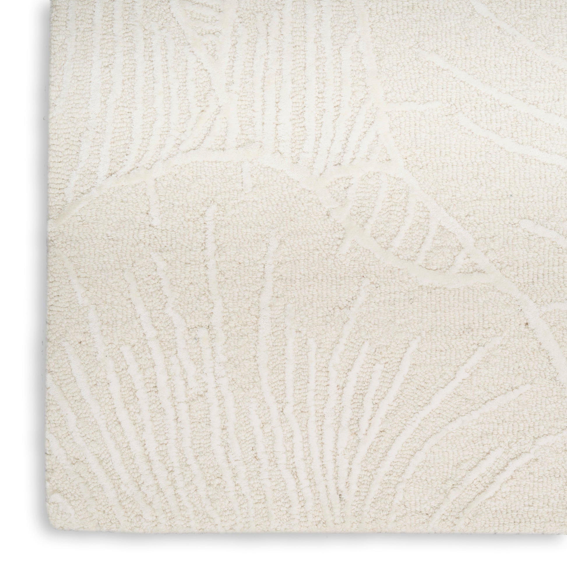 Cream textured rug with raised botanical leaf pattern; plush pile, rectangular, ideal for living room decor.