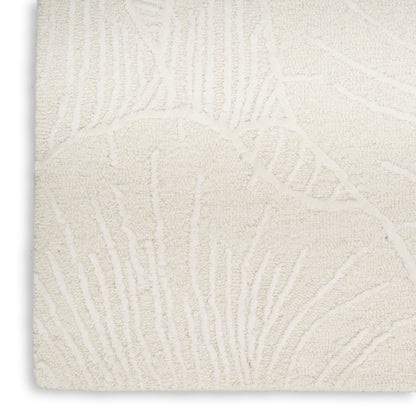 Cream textured rug with raised botanical leaf pattern; plush pile, rectangular, ideal for living room decor.