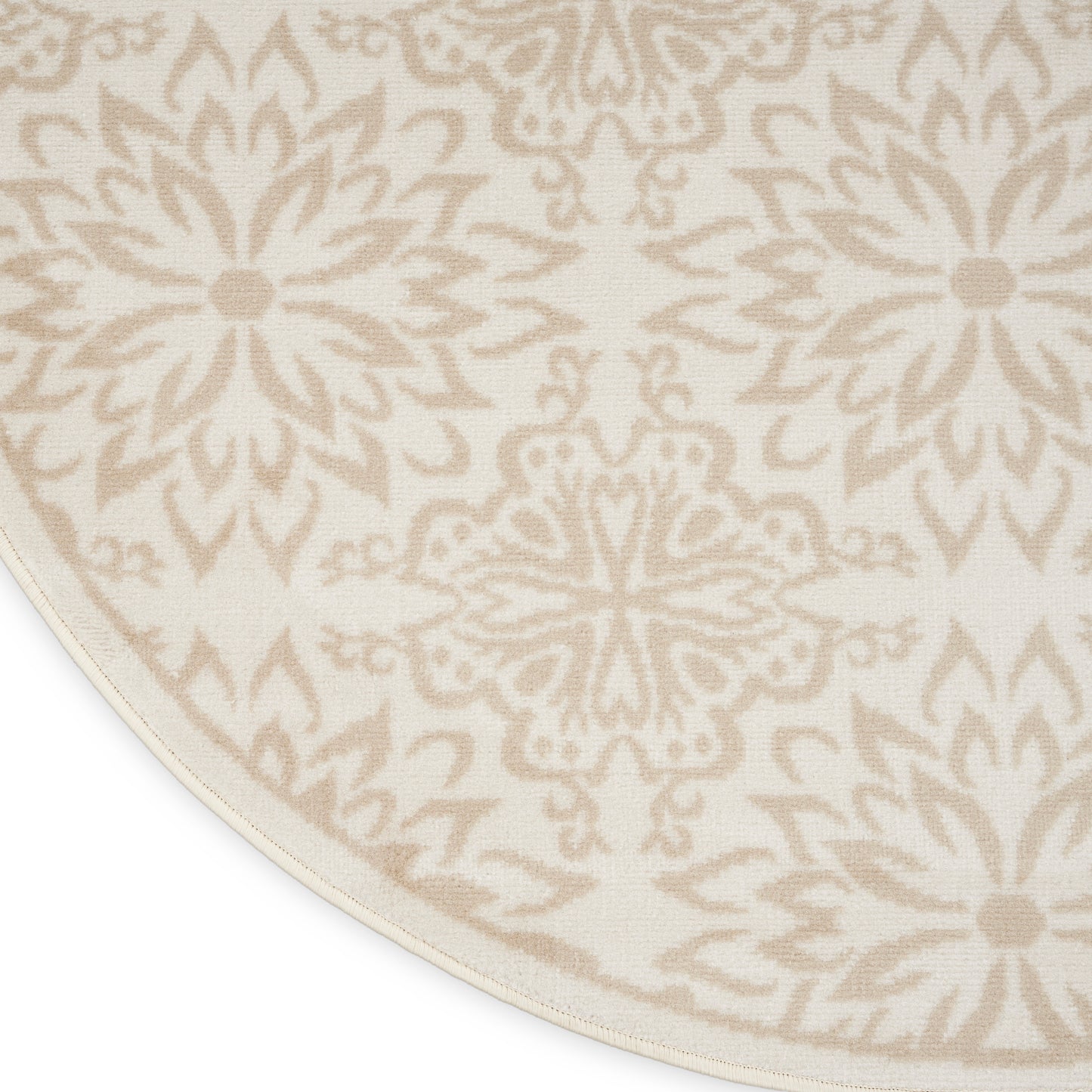 Round cream rug with beige ornate medallion pattern; woven textile in warm neutral tones.