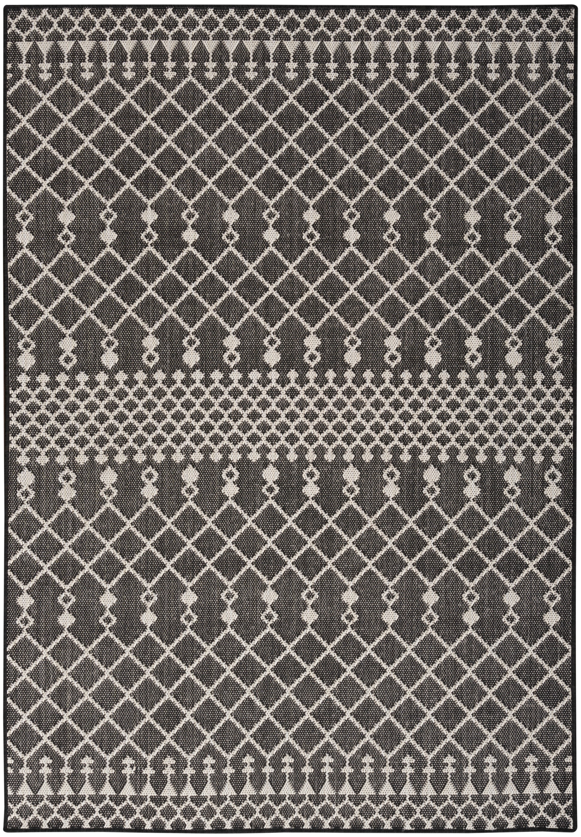 Charcoal rug with white diamond lattice pattern, small border motifs, and textured woven surface.