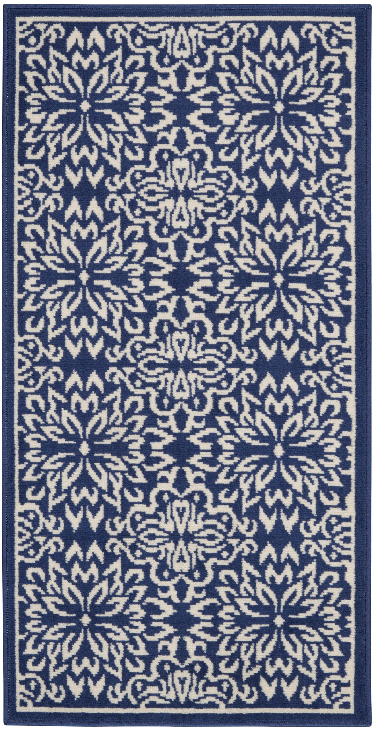 Navy blue rug runner with repeating ivory floral medallions and a navy border.