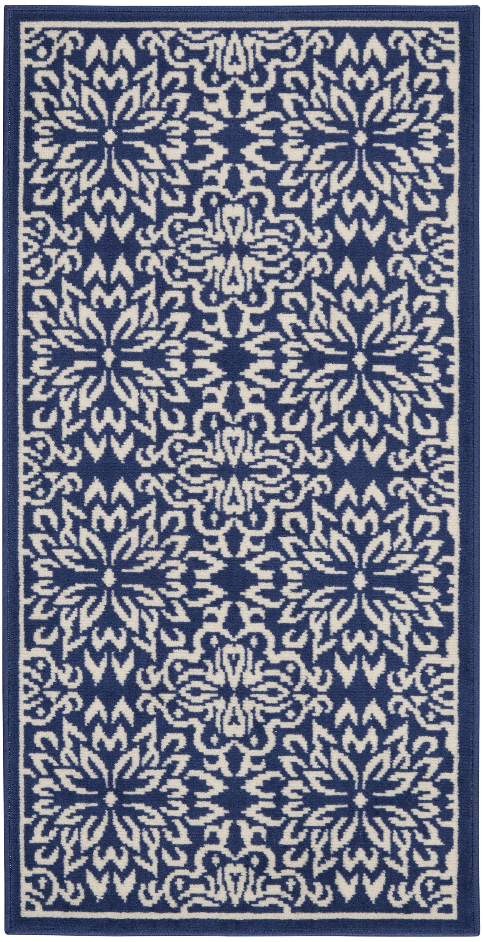 Navy blue rug runner with repeating ivory floral medallions and a navy border.