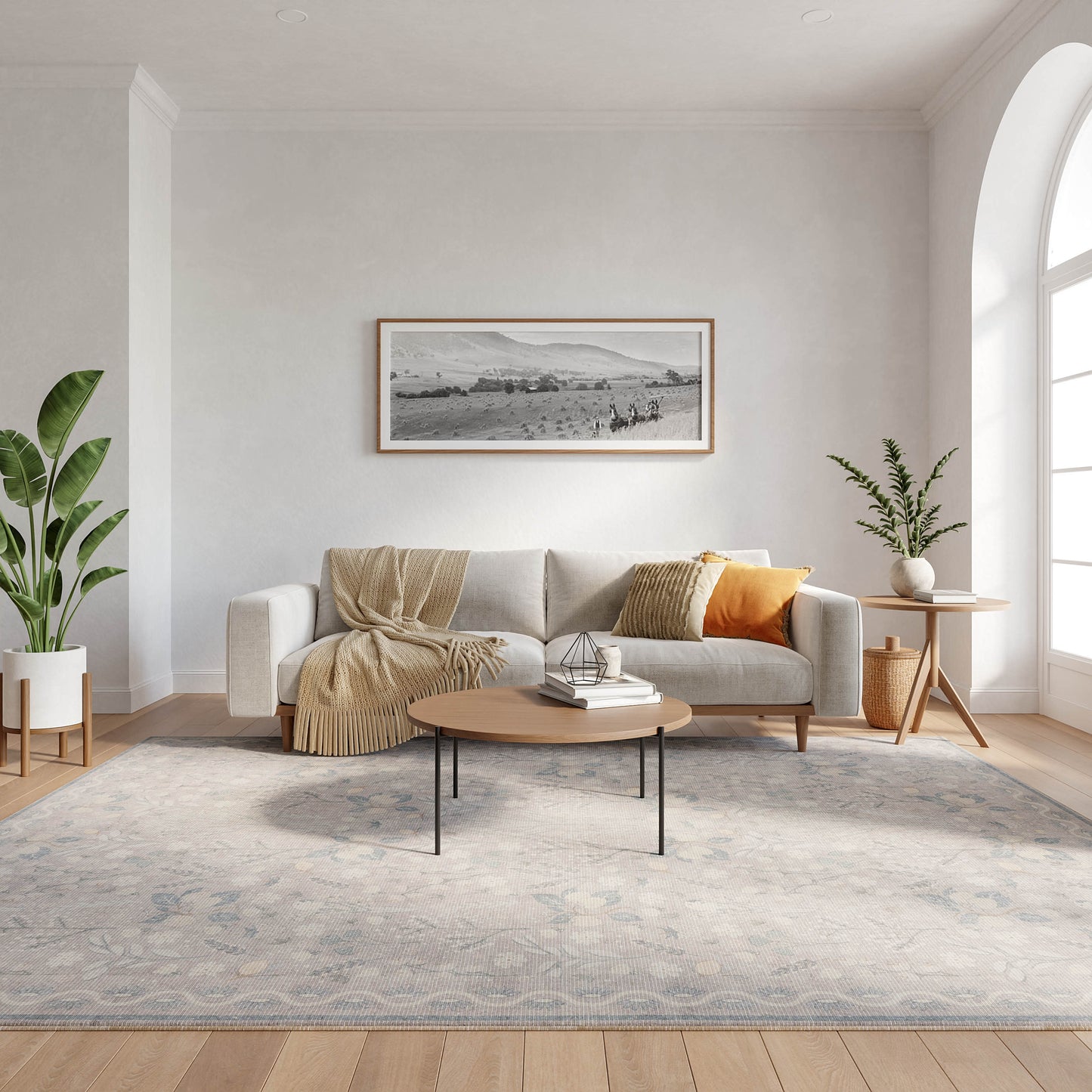 Scandinavian living room with beige sofa and throw blanket, round wood coffee table, blue-gray rug, potted plants, arched window.