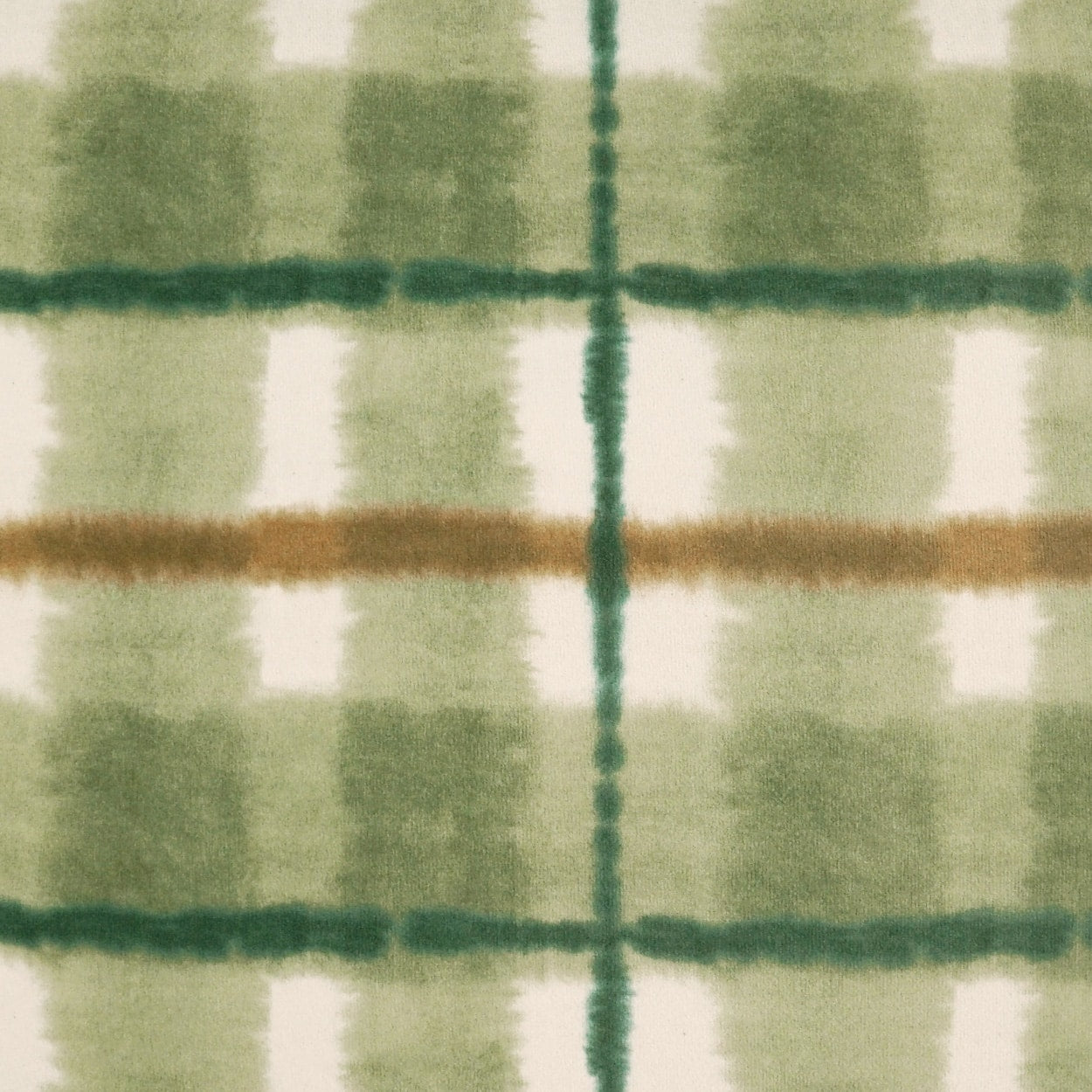 Soft fuzzy plaid fabric in green shades with white checks and a tan-brown cross stripe.