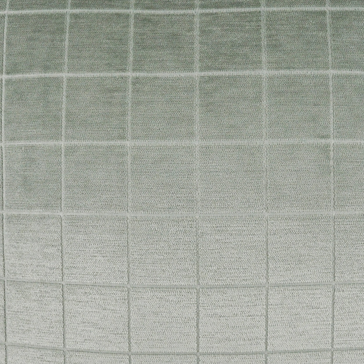 Light sage-green fabric with a subtle square grid pattern and soft, textured weave.
