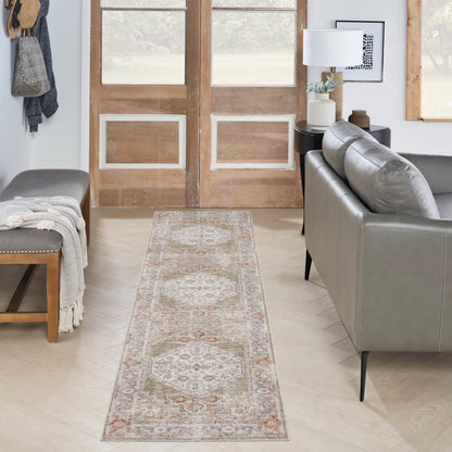 Long beige oriental runner rug with faded red and blue diamond motifs in a modern living room.