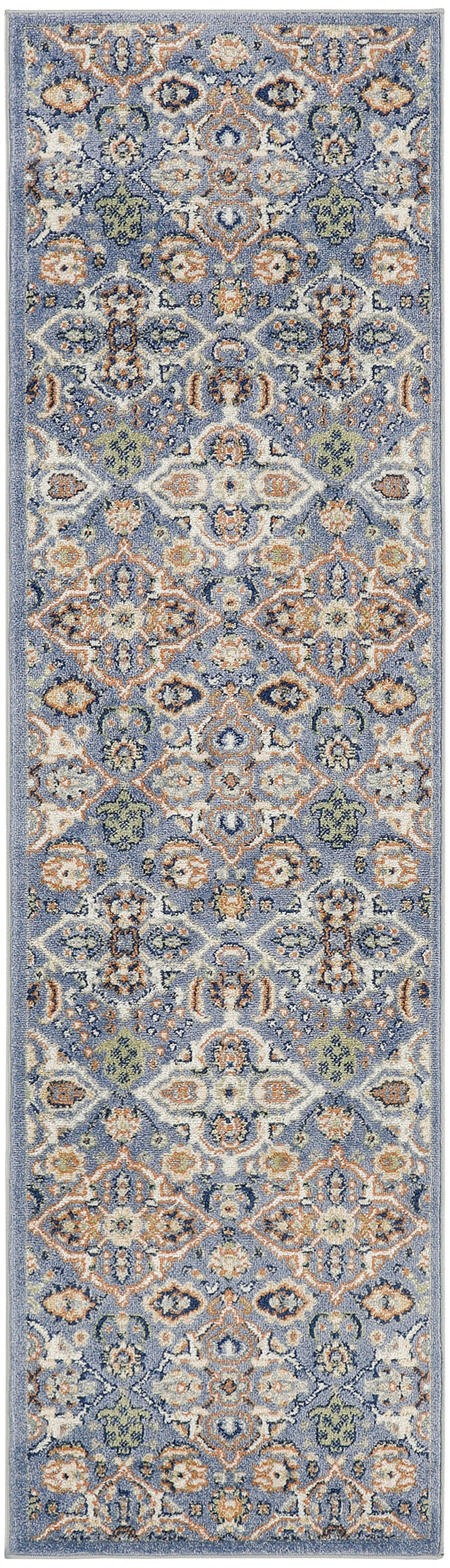 Blue oriental runner rug with intricate ivory, orange, and sage floral medallions; long narrow design.