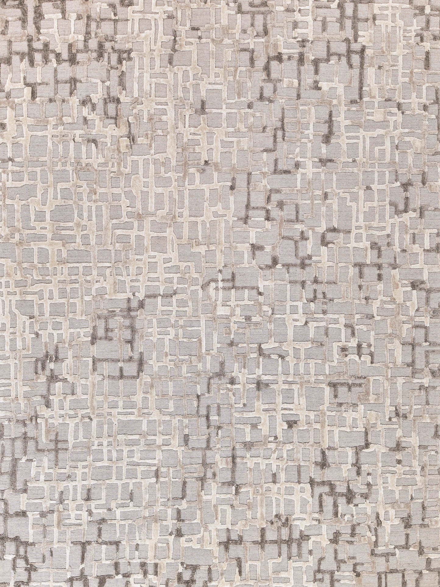 Neutral-toned rug with abstract beige and taupe mosaic grid, textured weave for modern living room decor.