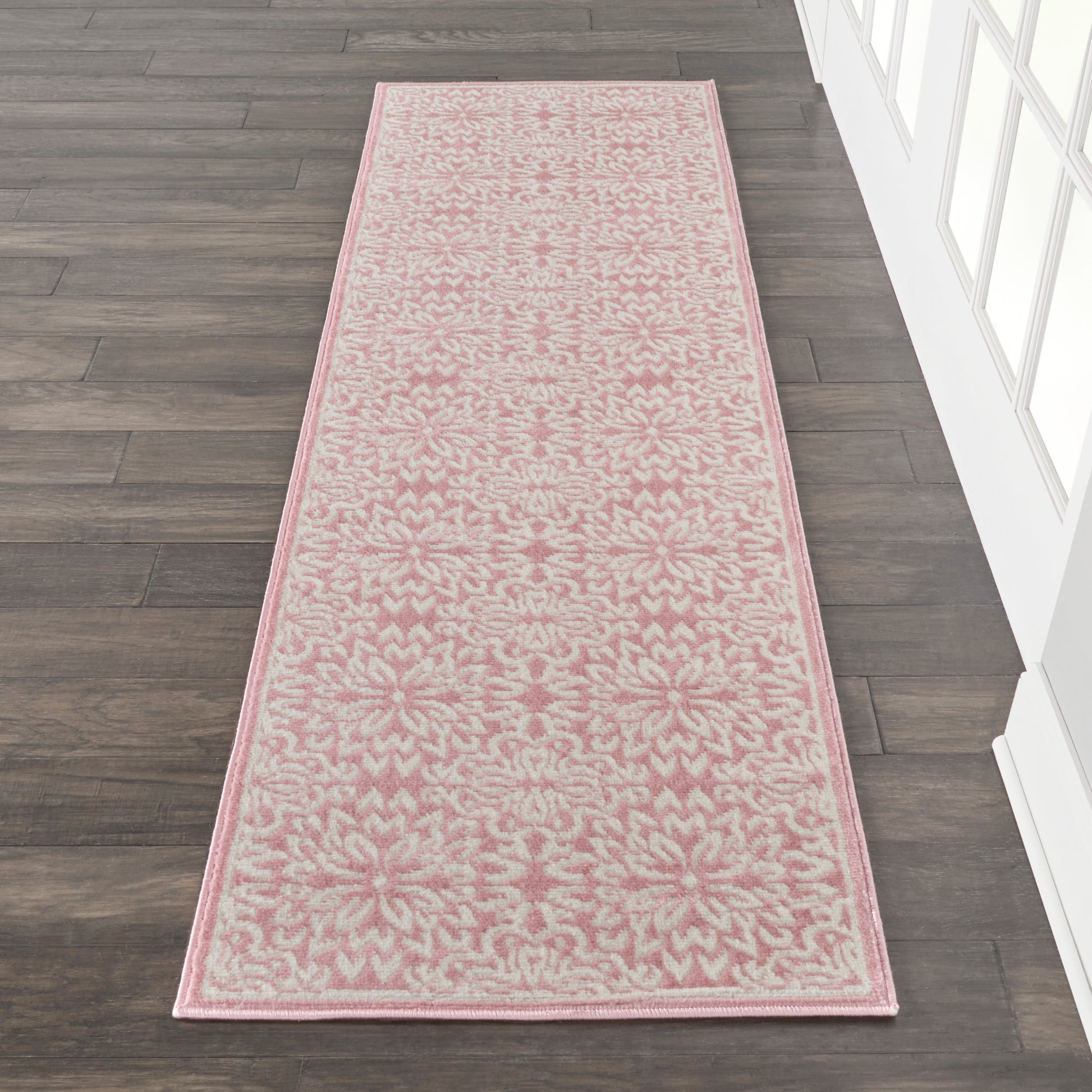 Long pink and ivory damask floral runner rug with pale pink border for hallway
