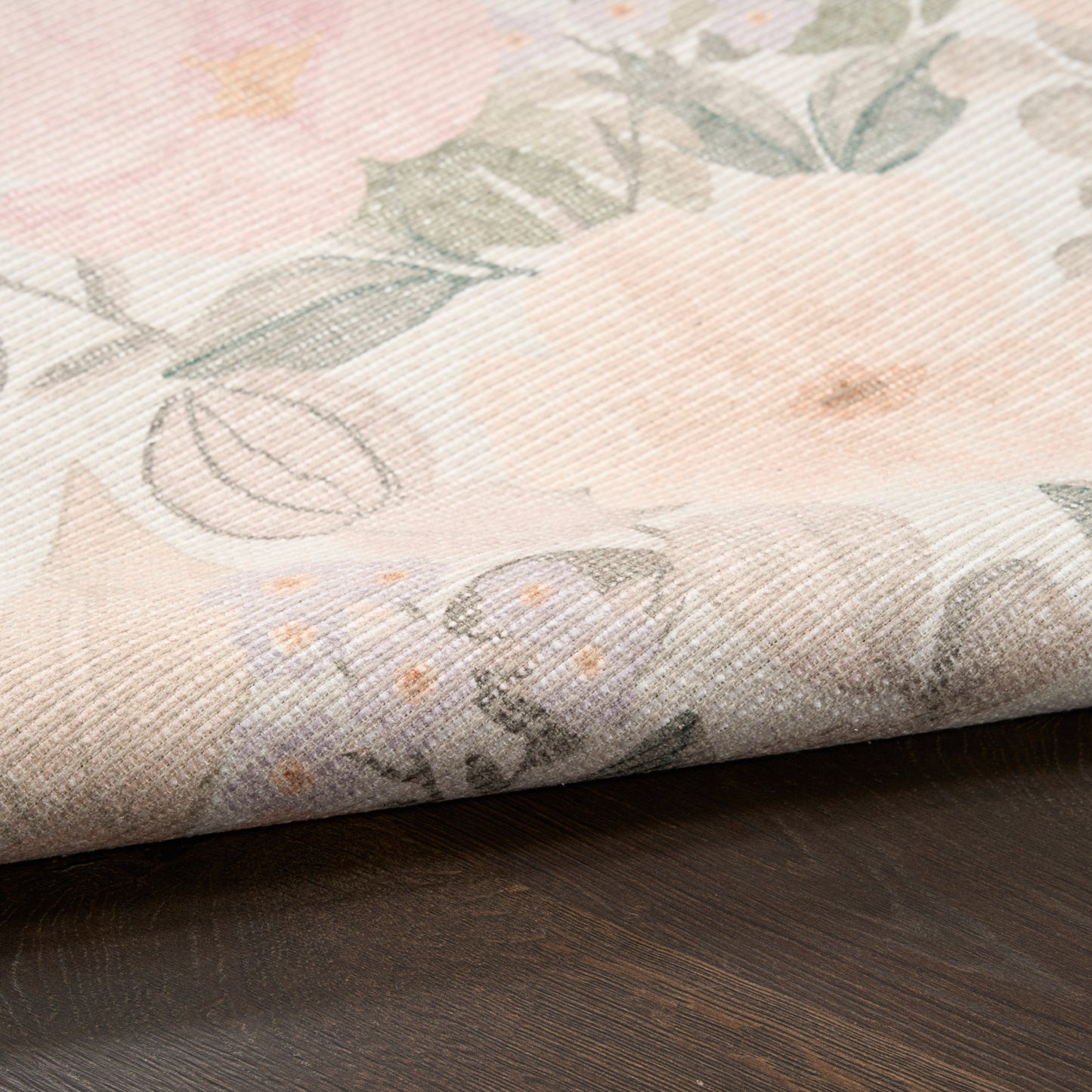 Pastel floral fabric with blush pink flowers, green leaves on a soft beige woven background; ideal for curtains.