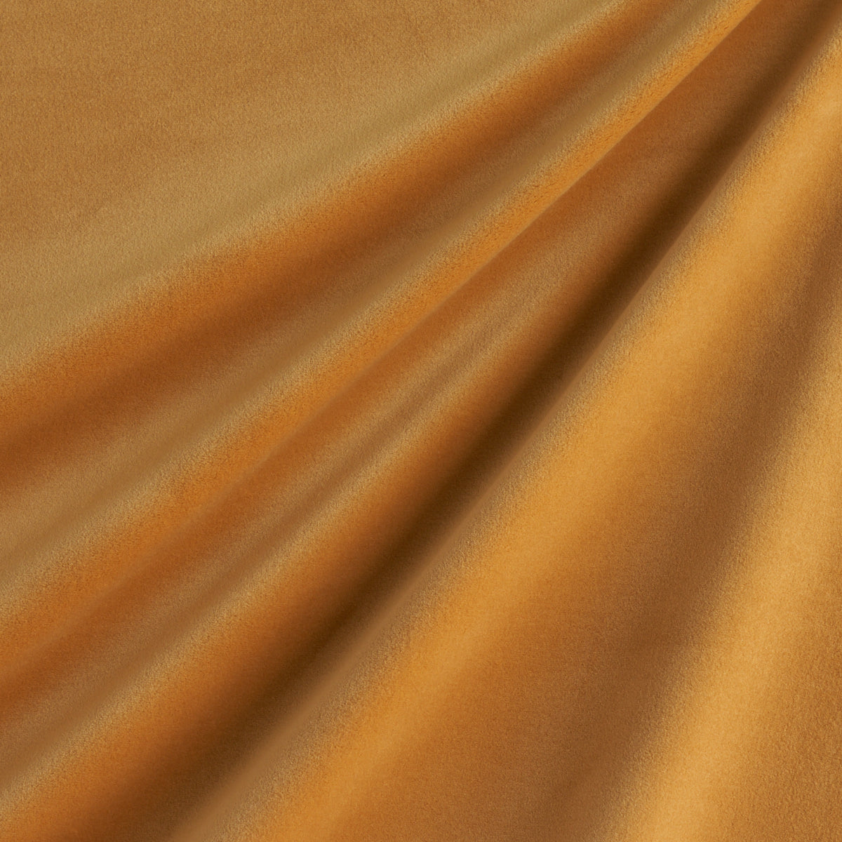 Golden velvet fabric with warm bronze tones & soft diagonal drapes.