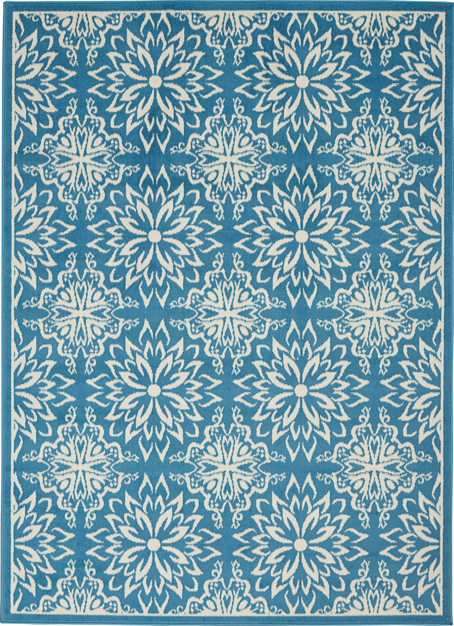 Teal-blue area rug with repeating white starburst floral medallions; rectangular with border.