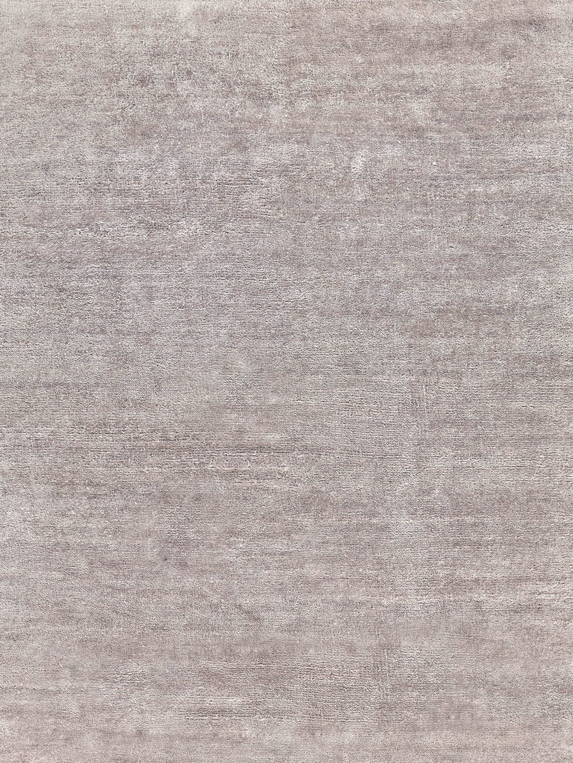 Taupe-gray textured rug with a mottled plush pile; soft, versatile for living room or bedroom.