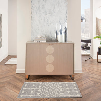 Gray geometric Bohemian rug, 2' x 4'.