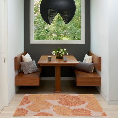 Wooden dining nook with L-shaped benches and square table, dark gray wall, white window, black pendant light, orange rug