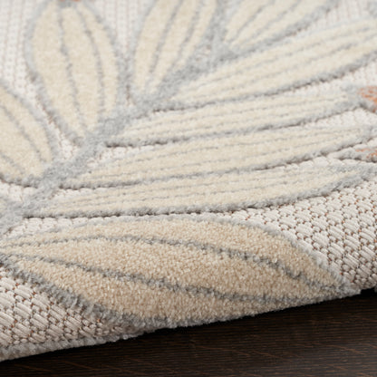 Cream and beige rug with soft plush pile and leaf-like pattern, woven texture for neutral decor.