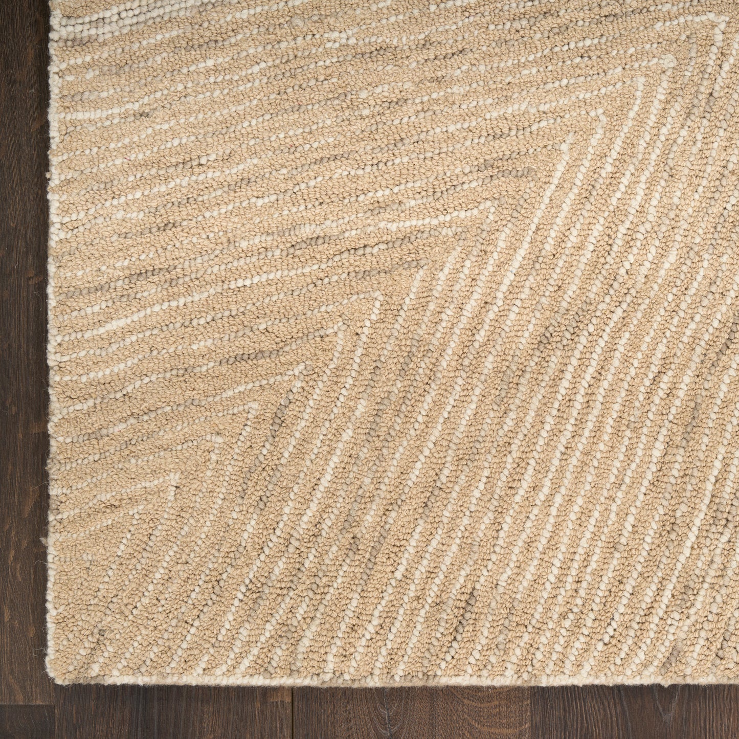 Natural beige woven jute runner rug with subtle chevron pattern on dark wood floor