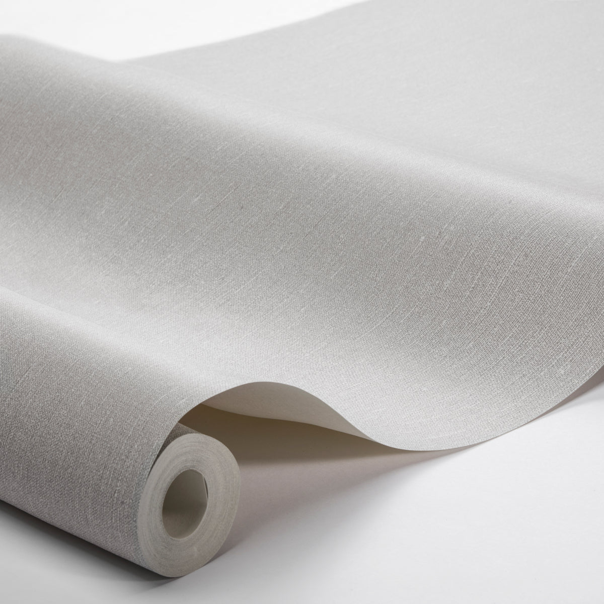 Rolled light gray fabric with subtle texture and linen-like weave, ideal for upholstery or crafts.