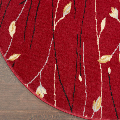 Red round rug, 4' diameter, with black linear stems and yellow leaves; modern botanical pattern.