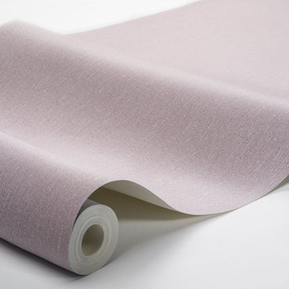 Pastel lavender wallpaper roll with a linen texture, curling edge as it unfurls.